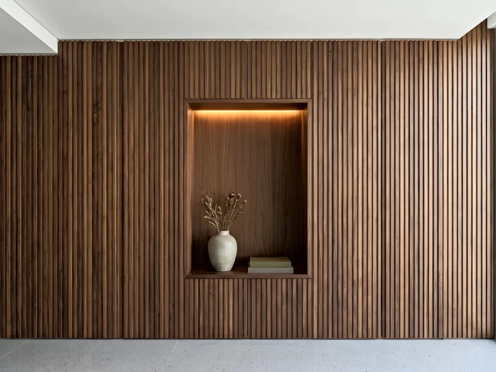 Fluted walnut wall panelling design